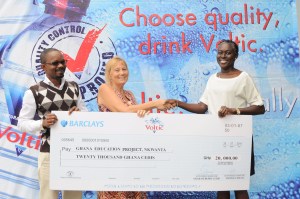 Corporate and Legal Affairs Director of Voltic (GH), Adjoba Kyiamah presenting the cheque to Gill Norris of GEP. Assisting them is the Corporate Affairs Manager of Voltic, Cyrus deGraft-Johnson