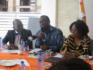 Dr Babatunde Ahonsi (middle) flanked by Mr.  Luc Armand Bodea and Mrs.  Pavelyn Tendai Musaka
